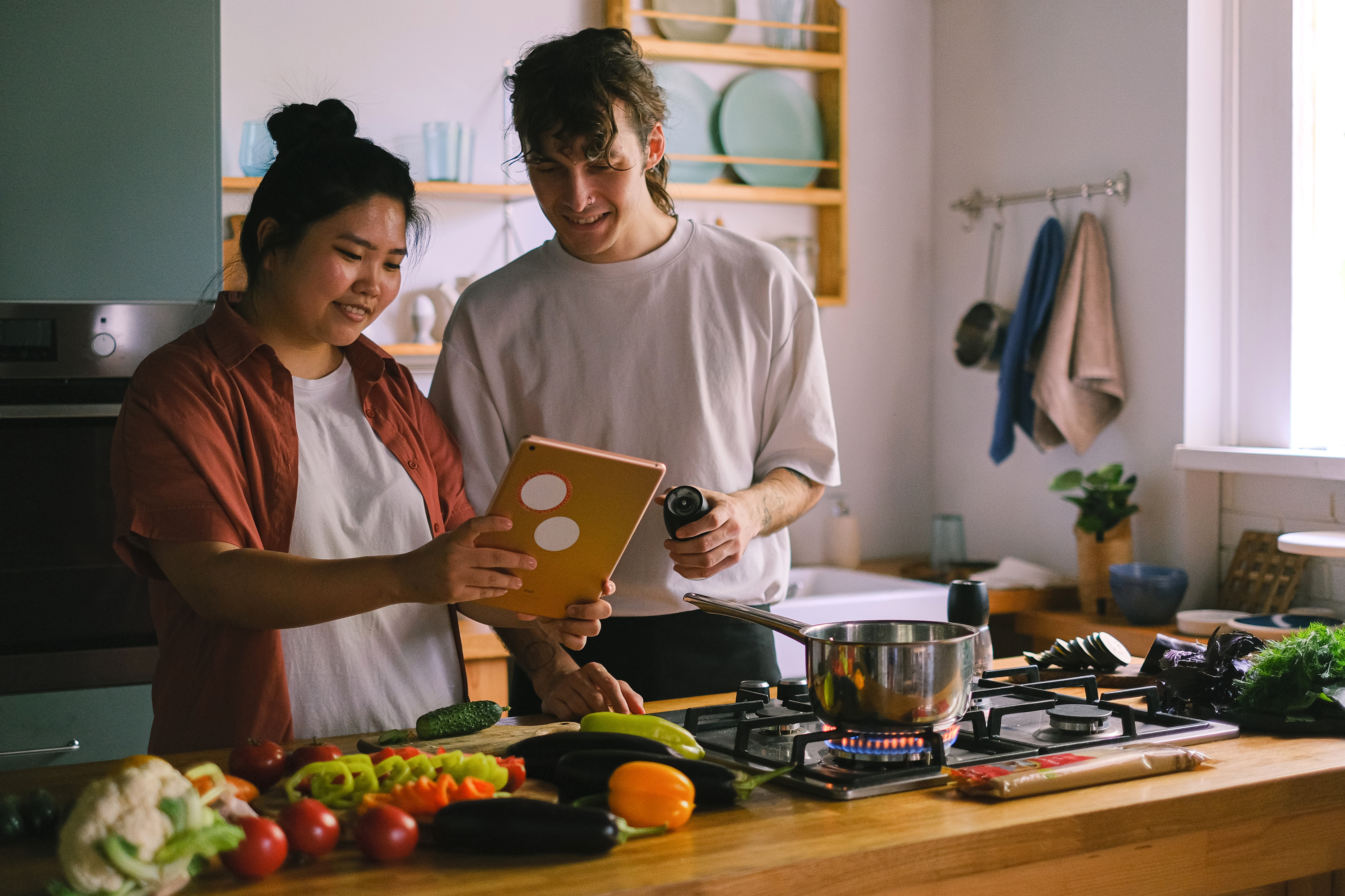 People cooking in a kitchen.